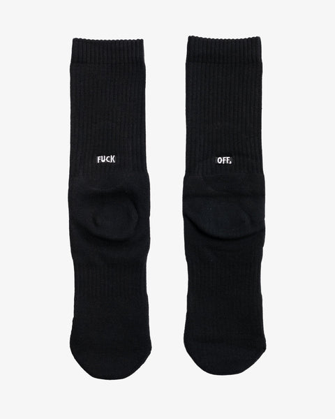 The back view of a white pair of socks with “FUCK OFF” embroidered in black.
