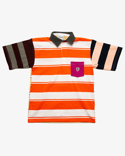Black patchwork rugby t-shirt with multi-coloured striped sleeves and a blue pocket featuring the RBW wolf logo.