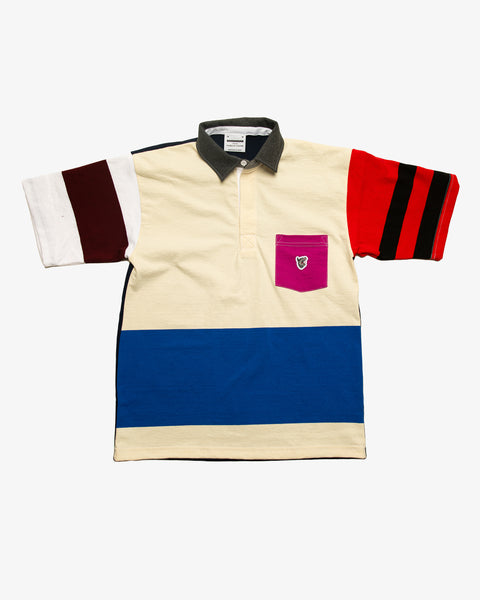 Black patchwork rugby t-shirt with multi-coloured striped sleeves and a pink pocket featuring the RBW wolf logo.