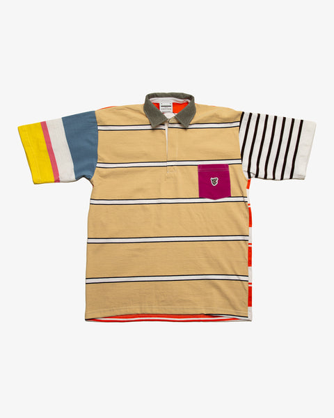 Blue striped patchwork rugby t-shirt with multi-coloured striped sleeves and a cream pocket featuring the RBW wolf logo