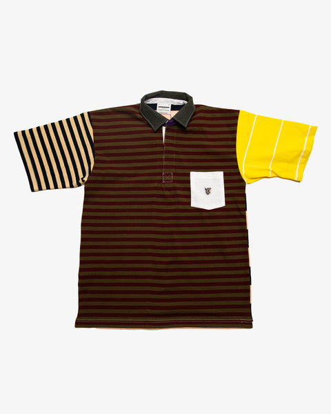 Maroon striped patchwork rugby t-shirt with multi-coloured striped sleeves and a white pocket featuring the RBW wolf logo. 