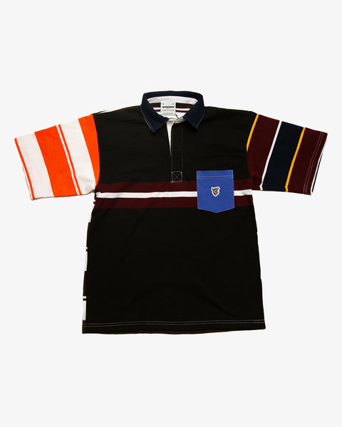 Orange striped patchwork rugby t-shirt with multi-coloured striped sleeves and a magenta pocket featuring the RBW wolf logo. 