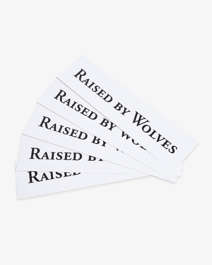 Five white Raised By Wolves logo stickers.